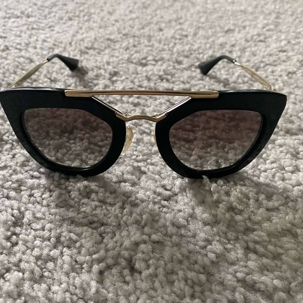 Prada woman’s sunglasses.
